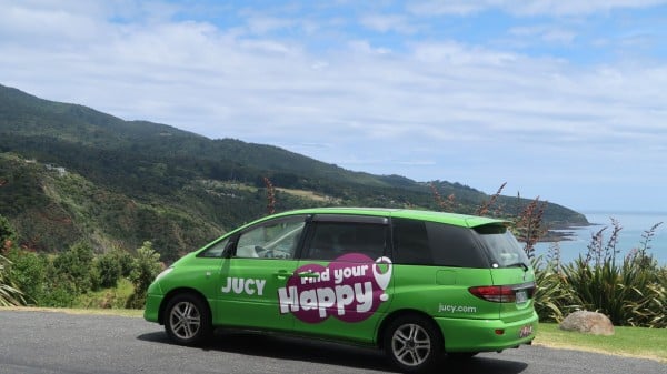 JUCY Crib Campervan driving on coastal cliffside