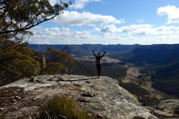top 3 road trip worthy hikes in nsw 3 Girl celebrating at the top of a mountain