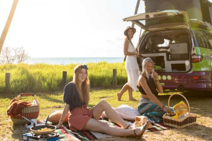 top 5 reasons to hire from jucy in australia 3 3 girls having a picnic and cooking with a JUCY campervan
