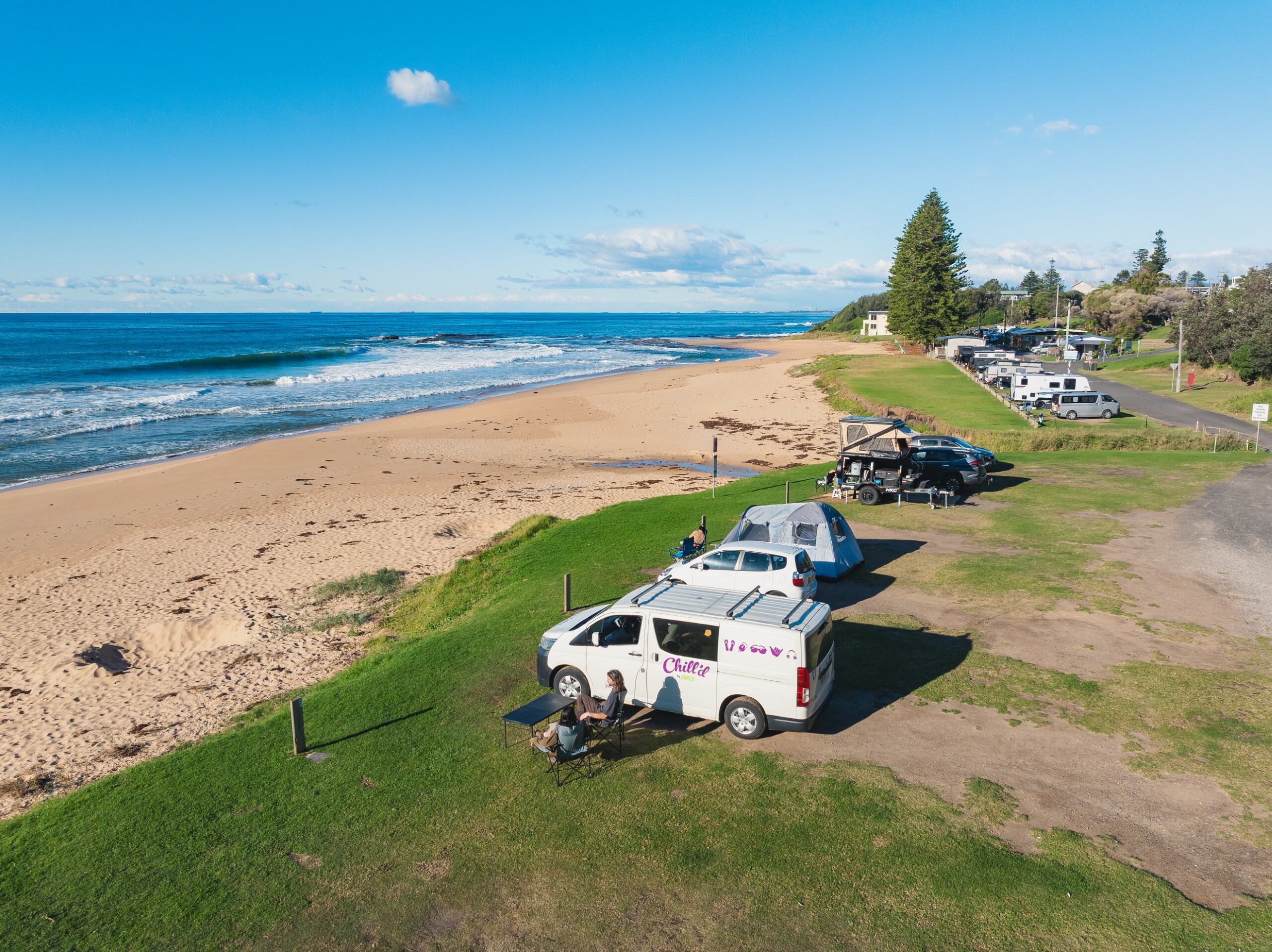 Adam and Clara with Chilld Malibu Campervan parked at Coledale Camping Reserve