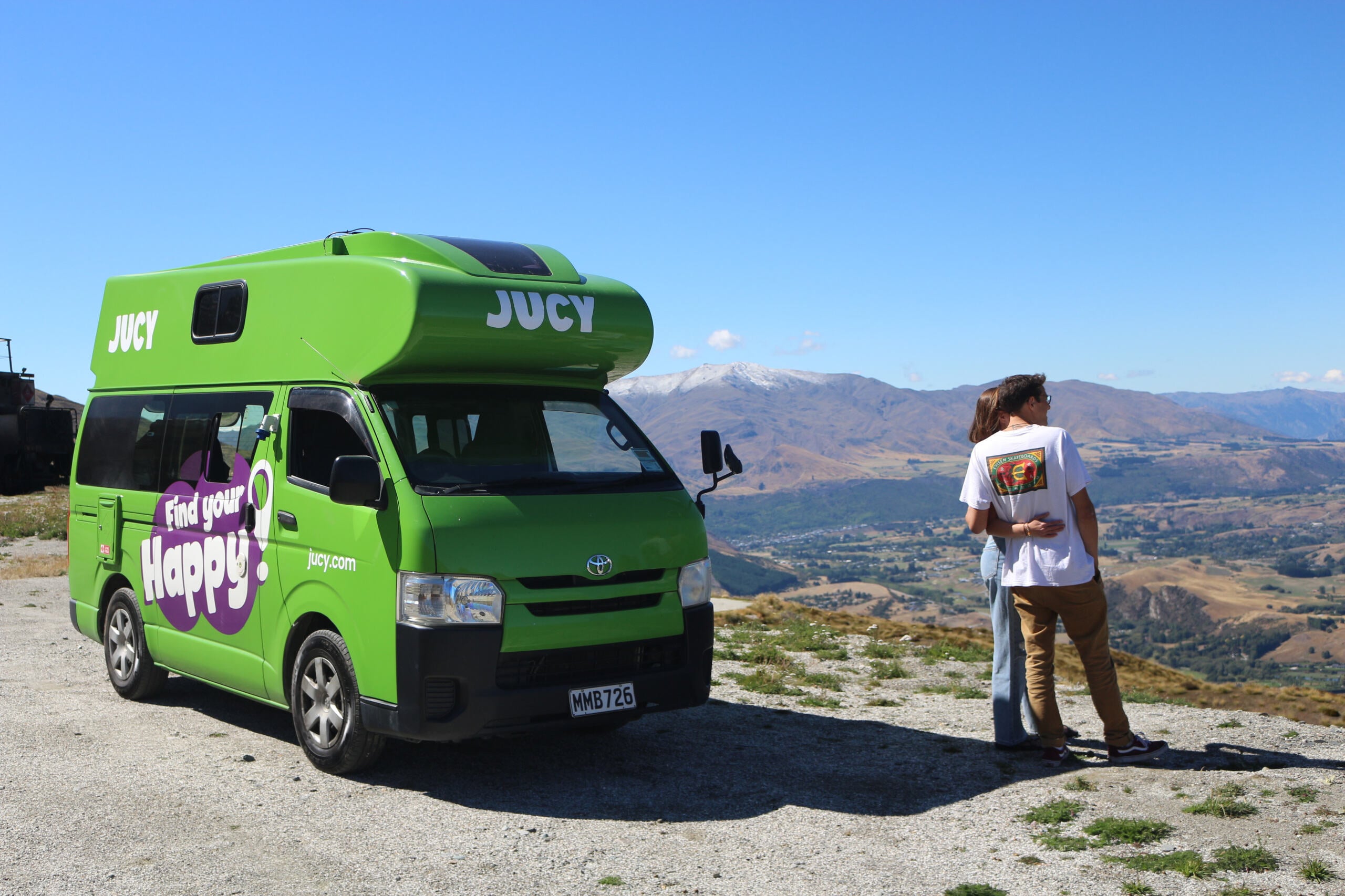 Couple In Front of Condo Campervan