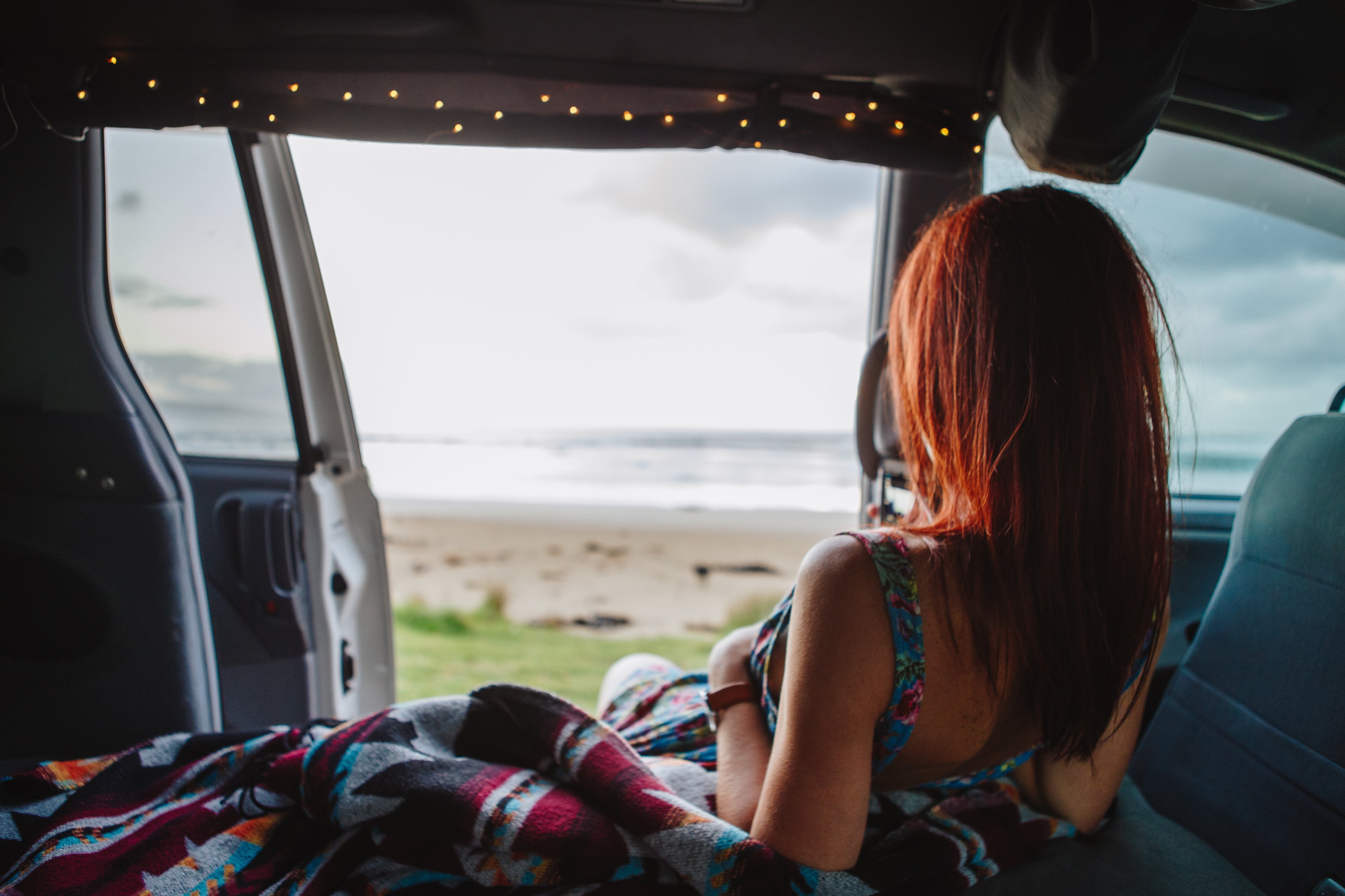Woman Sitting In Crib Campervan AUS