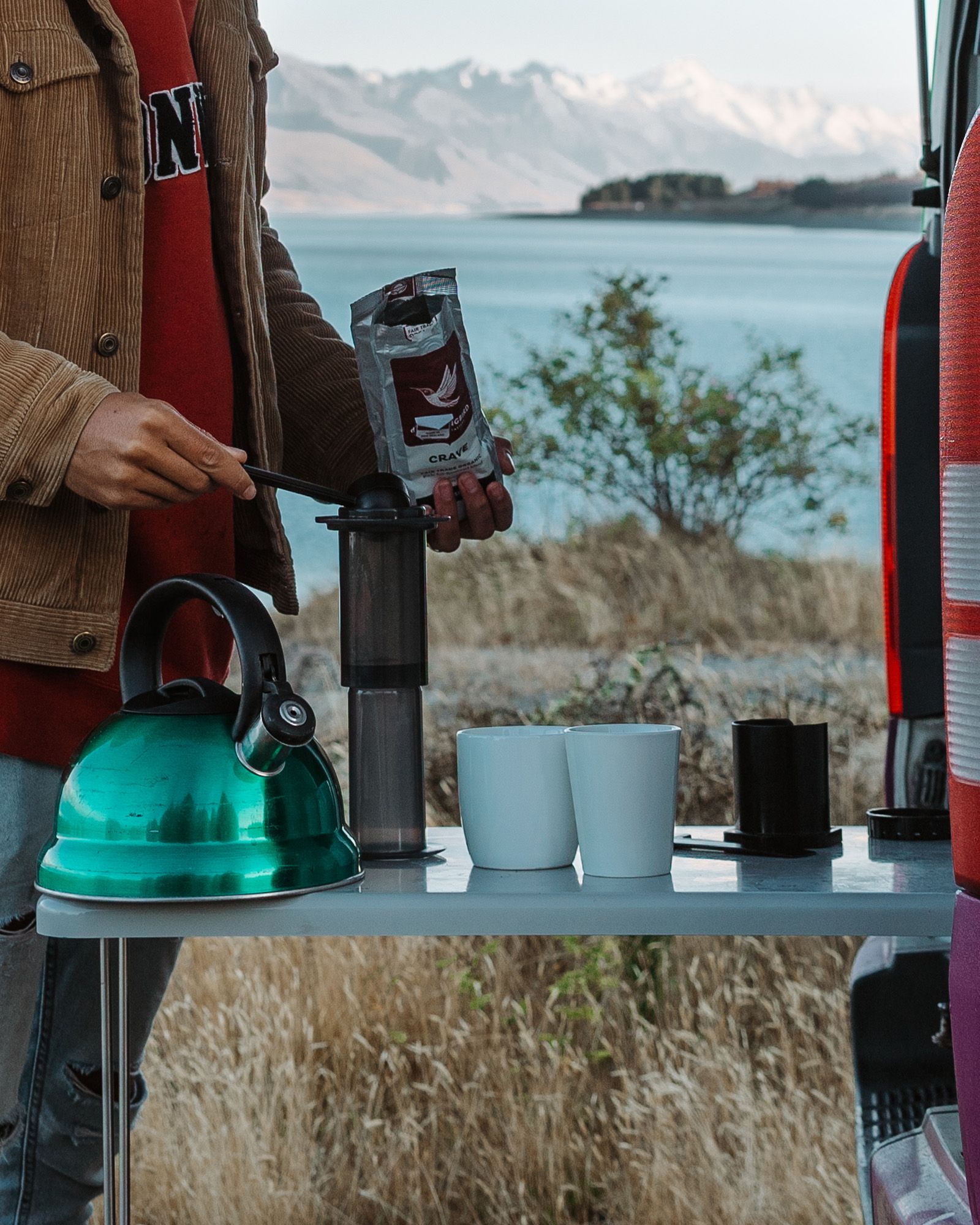 Kitchen and Kitchenware - Road-trip ready kitchen kit with utensils, pots, pans, plates, and a mini sink with fresh water in the kitchen. 