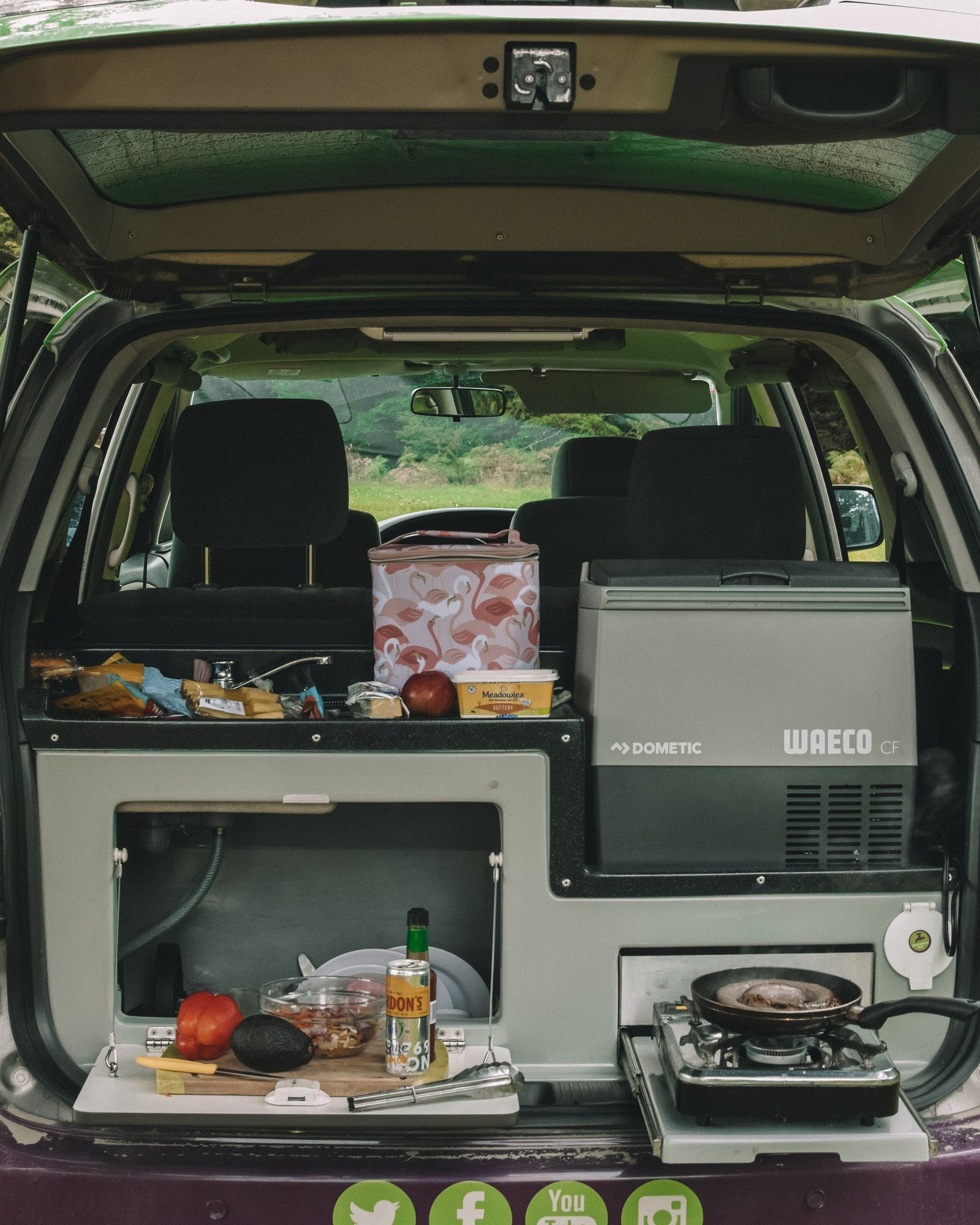 Kitchenware - Road-trip ready kitchen kit with utensils, pots, pans, plates, and a mini sink with fresh water in the kitchenette. 