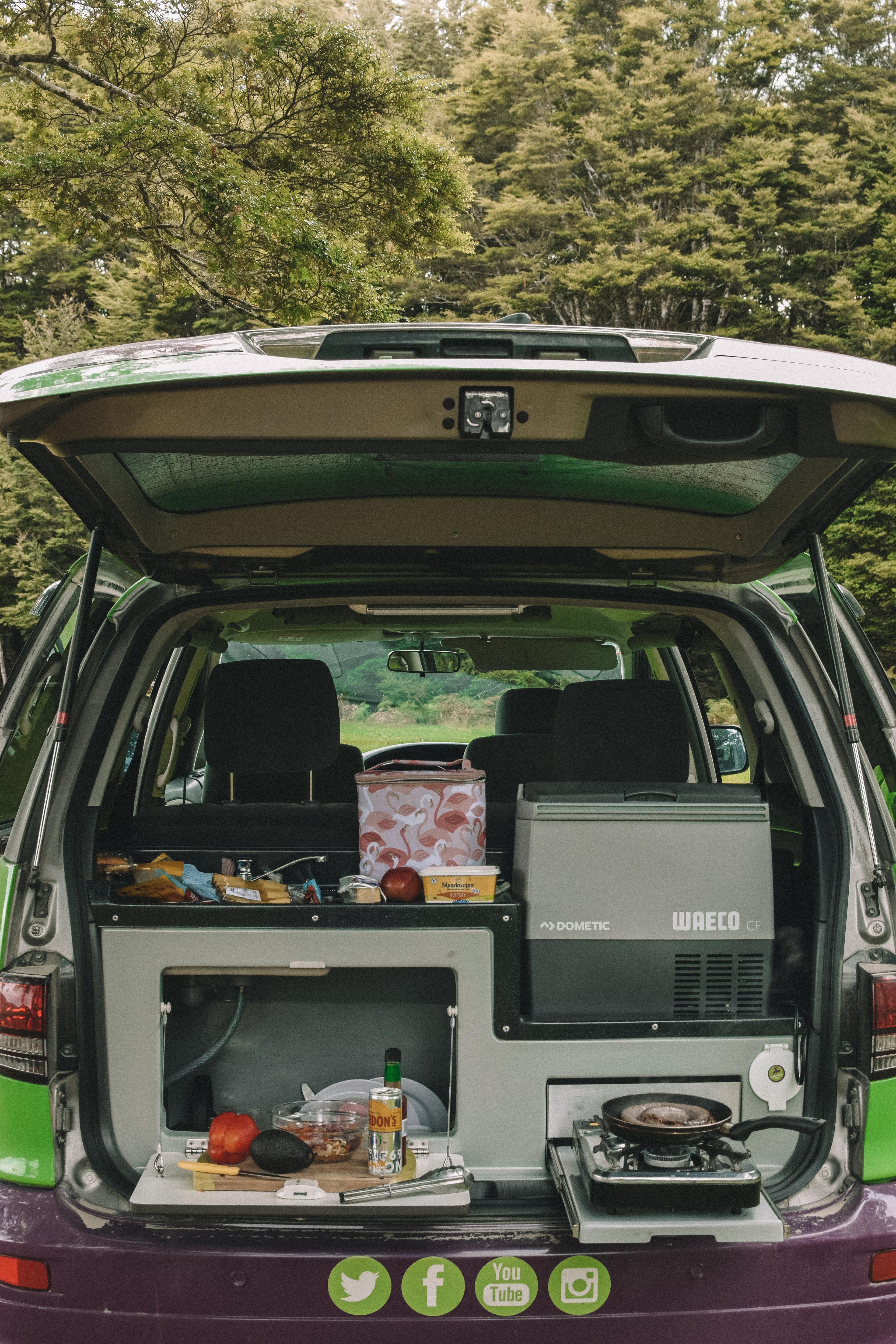 Kitchen and kitchenware - Road-trip ready kitchen kit with utensils, pots, pans, plates, and a mini sink with fresh water in the kitchenette. Kitchen and kitchenware - Road-trip ready kitchen kit with utensils, pots, pans, plates, and a mini sink with fresh water in the kitchenette.